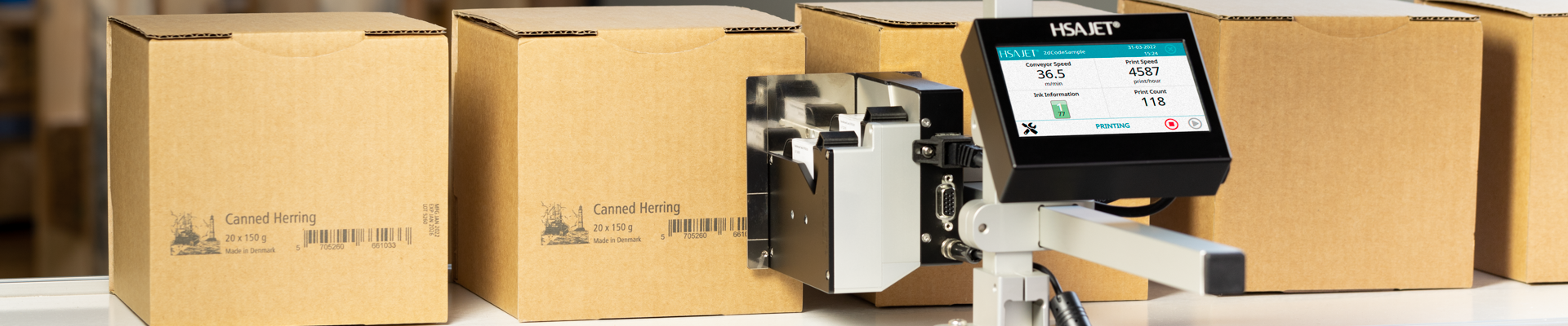 The HSAJET® MCX Compact 2-pen printing on cardboard boxes.